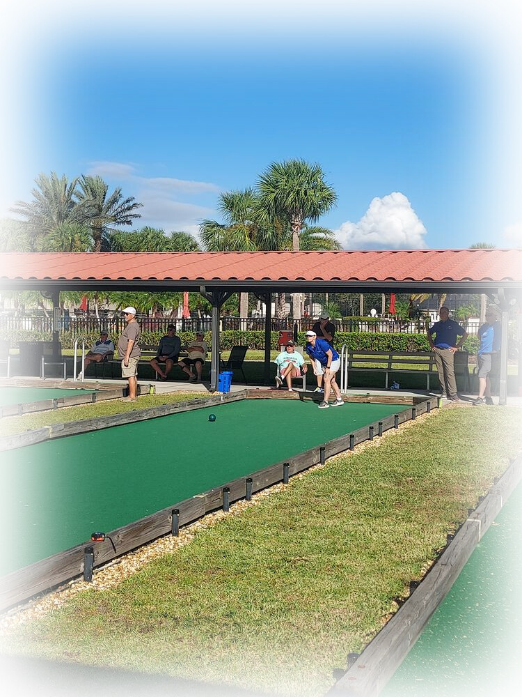 Covered bocce courts with players and spectators